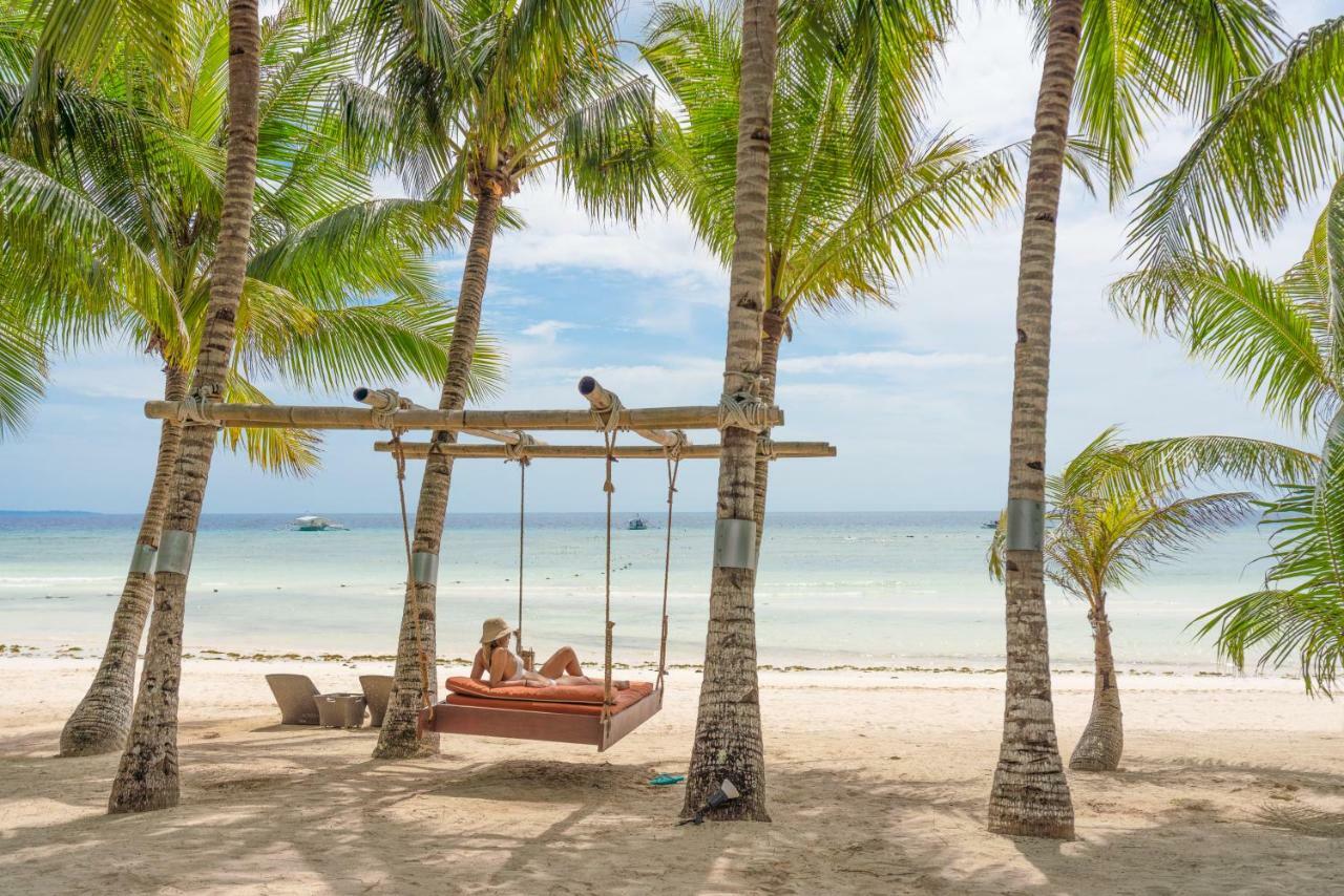 เซาท์ ปาล์ม รีสอร์ต Hotel ปางเลา ภายนอก รูปภาพ A swing at the beach